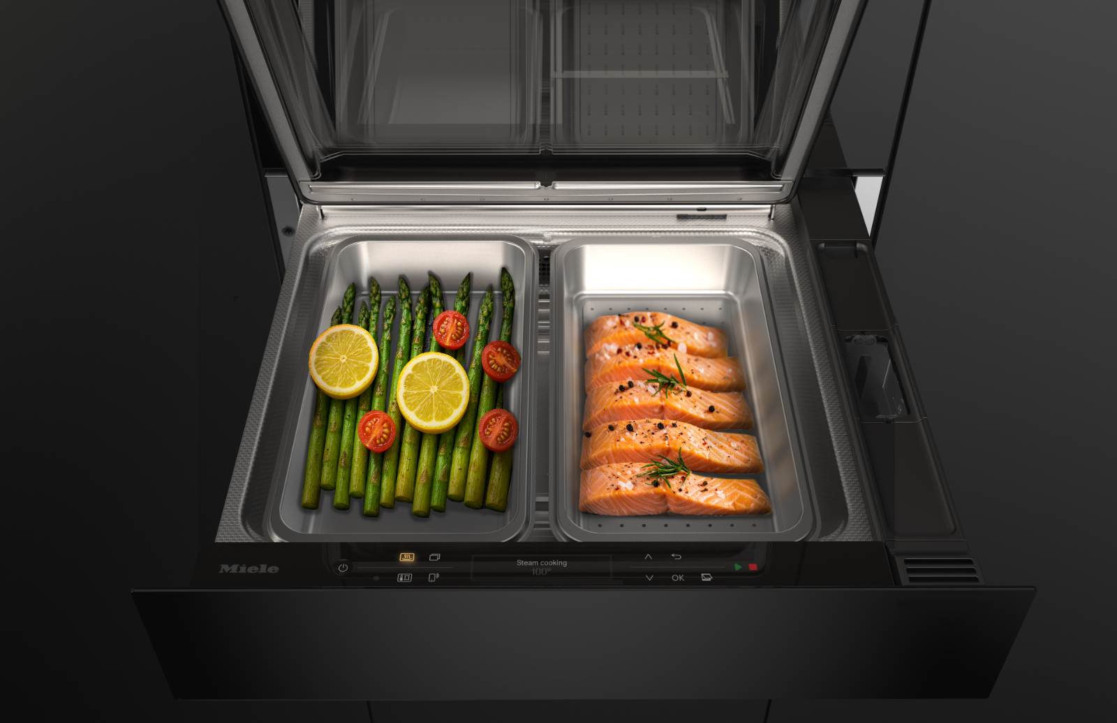Geöffnete Miele Dampfgarschublade mit Gemüse und Lachs